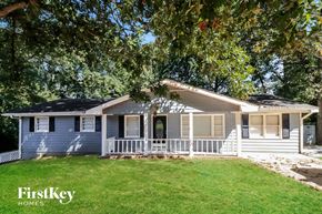 Union City house for rent - a small white house with a porch and a lawn