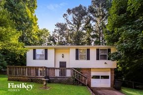 Jonesboro house for rent - a yellow and with a deck and a porch