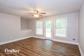 Canton house for rent - A room with a ceiling fan and wooden flooring.