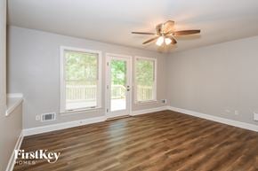 Canton house for rent - A room with a ceiling fan and wooden flooring.