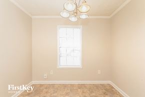 Mcdonough house for rent - a living room with a window and a light fixture