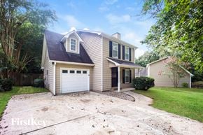 Peachtree City house for rent - A two-story house with a garage is for sale.