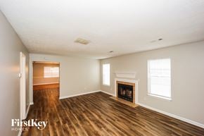 Peachtree City house for rent - A room with a fireplace and a window.