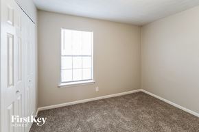 Lawrenceville house for rent - a bedroom with carpet and a window