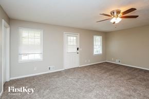 Lawrenceville house for rent - the master bedroom has a carpeted floor and a ceiling fan