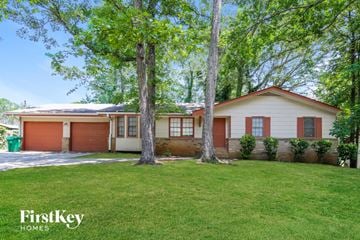 Stone Mountain house for rent - a house with two trees in front of it