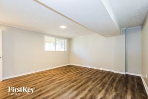 Jonesboro house for rent - A room with wooden floors and a window.