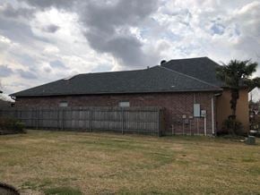 Youngsville house for rent - a brick house with a fence in front of it