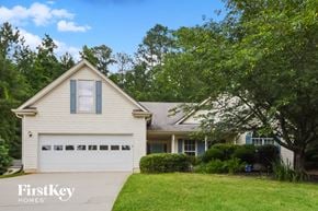 Covington house for rent - a white house with a white garage door