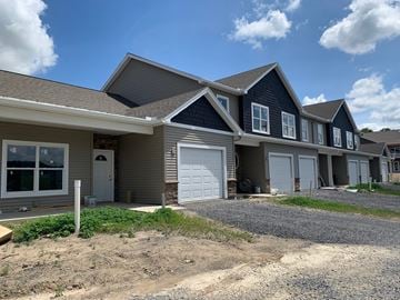 Penn Yan apartment for rent - a house with a white garage door and a gravel driveway