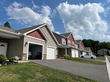 Penn Yan apartment for rent - a row of houses with cars parked in front of them