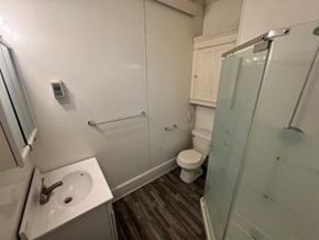 Fremont apartment for rent - A bathroom with a toilet, sink, and shower.