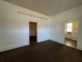 Fremont apartment for rent - A room with a brown carpet and white walls.