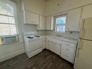 Fremont apartment for rent - A kitchen with white appliances and wooden floors.
