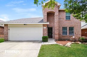 Princeton house for rent - A brick house with a garage door that says "Firstkey Homes".