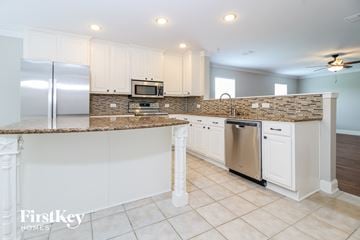 Princeton house for rent - A kitchen with a refrigerator, microwave, and dishwasher.