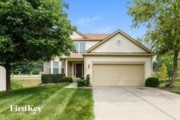 Kansas City house for rent - a home with a driveway and a garage door