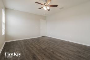 Port Orange house for rent - the spacious living room with wood flooring and a ceiling fan