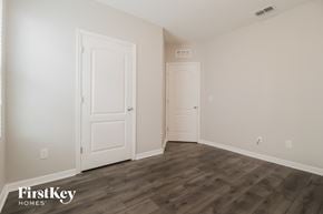 Port Orange house for rent - a bedroom with two doors and a door to a closet