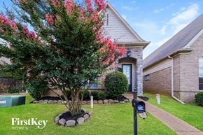 Memphis house for rent - the front yard of a house with a tree and a mailbox