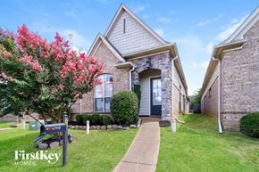 Memphis house for rent - a brick house with a blue mailbox in front of it