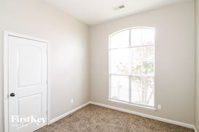 Memphis house for rent - a bedroom with a white door and a window