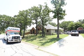 Joshua house for rent - a truck is parked in front of a house