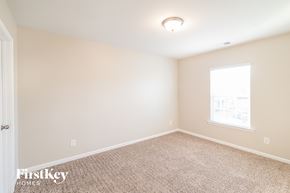 Summerville house for rent - a spacious room with carpet and a window