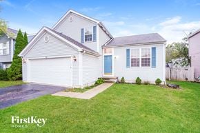 Galloway house for rent - A two-story house with a garage and a well-maintained lawn.