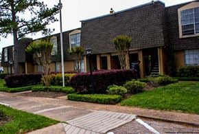 Houston apartment for rent - an apartment building with a walkway in front of it