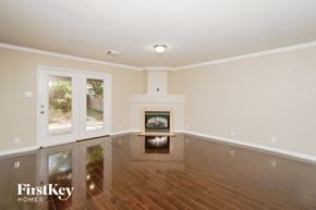 San Antonio house for rent - a living room with a fireplace and a wooden floor