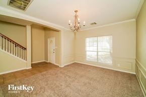 San Antonio house for rent - a dining room with a chandelier and a window