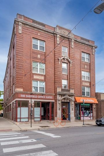 Chicago apartment for rent - a brick building on the corner of a city street