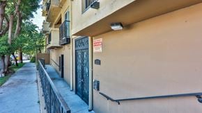 North Hollywood apartment for rent - an apartment building with a sign on the door and a sidewalk