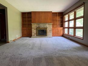 Canton apartment for rent - A living room with a fireplace and a grey carpet.