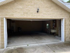 Canton apartment for rent - A garage with a white door is open and appears to be empty.