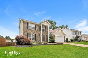 O'fallon house for rent - a brick house with a lawn in front of it