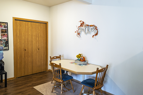 Ames apartment for rent - a dining room with a table and chairs and a door
