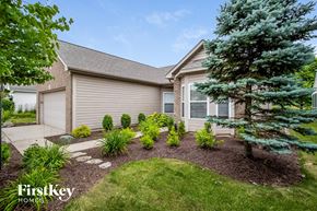 Noblesville house for rent - a home with a landscaped front yard and trees