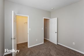 Noblesville house for rent - a bedroom with a closet and an open door