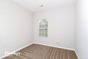 Winsten-Salem house for rent - a bedroom with white walls and carpet and a window