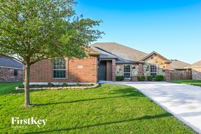 Red Oak house for rent - A house with a tree in front of it and the words "FirstKey Homes" on the bottom left.