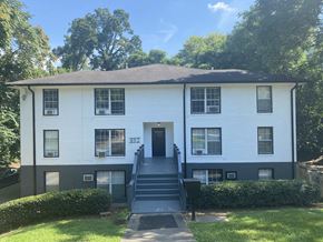 Atlanta apartment for rent - the front of a white house with black stairs