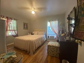 Atlanta apartment for rent - a bedroom with a bed and a dresser and a window