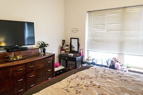 Ames apartment for rent - a bedroom with a bed and a tv in it
