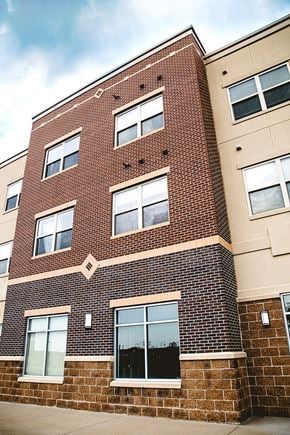 Ames apartment for rent - a brick building with many windows on it