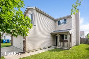 Noblesville house for rent - a white house with a porch and a lawn