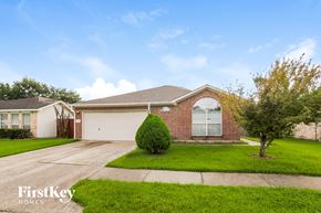 Baytown house for rent - A house with a tree in front of it.