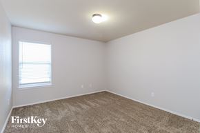 Fort Worth house for rent - the upstairs bedroom has a carpeted floor and a window