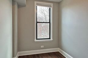 Oak Park apartment for rent - A window with a view of a tree covered in snow.